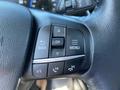 A close-up view of the steering wheel controls of a 2023 Ford Bronco Sport featuring buttons for back, menu, and phone functions