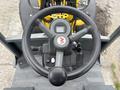 Overhead view of the steering wheel and control panel of a 2014 Wacker Neuson WL34 with various buttons and a display screen