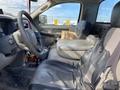 Interior of a 2009 Dodge Ram 5500 showing the driver's seat steering wheel and various items on the seat and floor