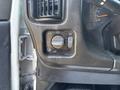 Interior dashboard controls of a 2005 GMC C7500 Topkick including headlight switch and various knobs for vehicle settings
