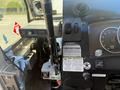 Interior view of a 2009 Workhorse W62 showing the dashboard with gauges switches a gear shift and a warning label
