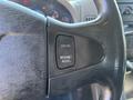 Close-up of a steering wheel with cruise control buttons labeled "SET" and "RESUME/ACCEL"