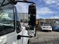 A 2014 International TerraStar truck is shown with a focus on its side mirror showcasing its large size and commercial design