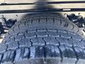 Close-up of a tire from a 2019 Freightliner M2 106 showcasing its tread pattern and texture