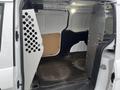 Interior of a 2017 Ford Transit Connect showing a spacious cargo area with metal partition panels on either side