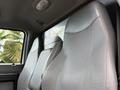 Interior view of a 2017 Ford F-750 showing three gray fabric seating areas in the cabin