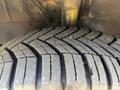 Close-up of a tire with deep tread patterns from a 2018 Ford Transit-350