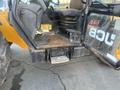 A 2013 JCB 510-56 Loadall with a visible operator's cabin featuring controls seat and footstep for access
