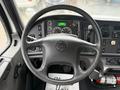 Interior view of a 2019 Freightliner M2 steering wheel and dashboard displaying various truck gauges and controls