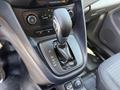 A close-up of the gear shift in a 2021 Ford Transit Connect featuring a manual transmission with settings labeled P R N O M