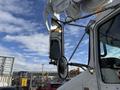 A 2008 Kenworth T370 truck featuring a large boom arm and attached mirrors reflecting its surroundings