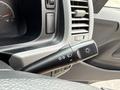 The image shows the control stalk of a 2009 Toyota Hiace featuring settings for headlights and turn signals