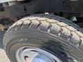 Close-up of a rugged tire from a 2017 Ford F-250 SD showcasing a tread pattern designed for off-road traction