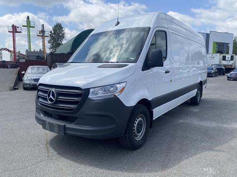 A 2025 Mercedes-Benz Sprinter van with a white exterior and black accents parked in a lot
