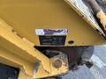 A yellow 2014 Vermeer Corporation Sweep Stump Cutter with visible manufacturer label and mechanical components