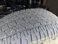 A close-up view of a tire on a 2016 Chevrolet Silverado 2500HD showing tread patterns and texture