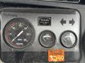 Dashboard of a 2011 Kubota RTV 1140 CPX showing speedometer fuel gauge temperature gauge and hour meter with an oil change reminder sticker