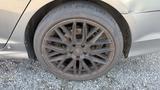 Close-up of a muddy wheel and tire of a 2018 Hyundai Sonata displaying a multi-spoke design