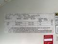 A label detailing specifications for a 2009 International 3000 CE including tire sizes pressure ratings and manufacturing information