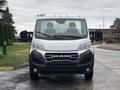 A 2023 RAM Promaster 3500 van shown head-on with a large grille featuring the RAM logo and two side mirrors visible
