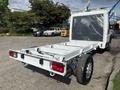 A 2023 RAM Promaster 3500 single cab chassis with a white frame and rear wheels visible in the foreground