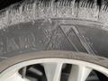 Close-up of a winter tire on a 2017 Ford Edge featuring a snowflake and mountain symbol indicating winter performance capability