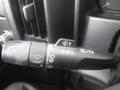 A close-up of the turn signal and wiper control stalk of a 2015 Chevrolet Silverado 1500 showing various settings and indicators