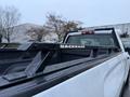 A 2017 GMC Sierra 3500HD with a black BACKRACK mounted in the truck bed