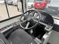 Interior view of a 2018 Grande West Vicinity bus showcasing the driver's seat dashboard steering wheel and control panel