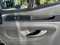 The interior door panel of a 2024 Mercedes-Benz Sprinter 2500 featuring a handle control and window adjustment buttons