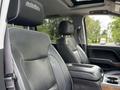 Interior view of a 2017 Chevrolet Silverado 1500 with black leather seats and a central console between the seats
