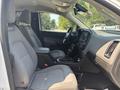 Interior view of a 2017 Chevrolet Colorado showing front seats and console with dashboard controls and gear shift