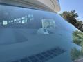 A 2020 Chevrolet Express dashboard visible through the windshield with a device mounted on it