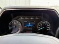 Dashboard of a 2021 Ford F-150 showing speedometer, tachometer, and digital display indicating zero kilometers per hour
