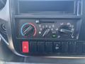 Control panel of a 2018 Hino 195 featuring climate controls including dials for temperature and fan speed as well as buttons for various functions