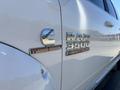 A white 2018 RAM 3500 truck featuring a Cummins Turbo Diesel emblem and heavy-duty badge on the side panel