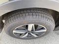 A close-up of a tire and alloy wheel from a 2022 Kia Sorento showing tread pattern and wheel design