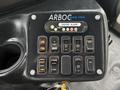 Control panel of a 2018 Chevrolet Express with various buttons for door control interior light ramp operation and emergency functions