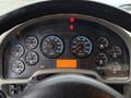 Dashboard of a 2012 International 7400 displaying various gauges including speedometer, tachometer, and indicators for oil, water, and volts