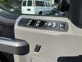 Interior panel of a 2019 Ford F-550 featuring controls for windows mirrors and lights