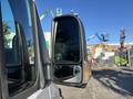 A close-up view of the side mirror of a 2024 Mercedes-Benz Sprinter 2500 with a reflective surface showing a smaller side mirror attached
