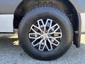 A 2021 Mercedes-Benz Sprinter 2500 with a stylish alloy wheel featuring multiple spokes and a black tire with clear tread patterns