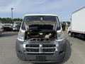 A 2017 RAM Promaster van with the hood lifted exposing the engine compartment showcasing various automotive components and parts