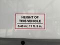 A label on a vehicle indicating the vehicle's height as 3.43 m or 11 ft 3 in