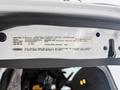 A label inside the door frame of a 2016 Freightliner 108SD displaying vehicle emission control information and specifications