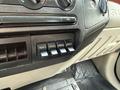 Interior panel of a 2008 Ford F-450 showing control switches for auxiliary power numbered AUX 1 to AUX 4