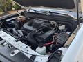 Engine compartment of a 2017 Chevrolet Colorado showing various components like the air intake battery and coolant reservoir
