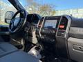 Interior view of a 2020 Ford F-350 with a touchscreen display climate controls and steering wheel visible