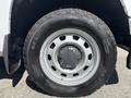 A close-up of a silver alloy wheel with a Chevrolet logo on a 2011 Chevrolet Colorado mounted with a General tire