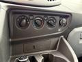 Dashboard controls of a 2018 Ford Transit featuring dials for temperature settings air circulation and a 12V power outlet